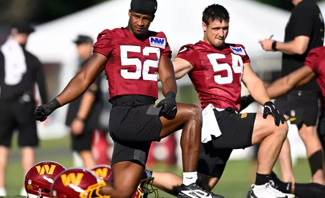 Washington Commanders linebackers Sonny Styles (52) and Leo Chenal work out during practice at the team's NFL football training camp, Thursday, July 30, 2026, in Ashburn, Va. (AP Photo//John McDonnell)