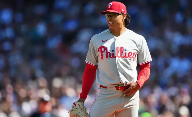 Philadelphia Phillies starting pitcher Jesús Luzardo reacts after giving up a single to Seattle Mariners' Jhonny Pereda during the fifth inning of a baseball game, Wednesday, Aug. 26, 2026, in Seattle. (AP Photo/Lindsey Wasson)