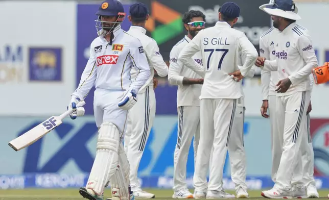 Sri Lanka's captain Dhananjaya de Silva walks off the filed after losing his wicket during the day three of the first cricket test match between Sri Lanka and India In Galle, Sri Lanka, Monday, Aug. 17, 2026. (AP Photo/Eranga Jayawardena)