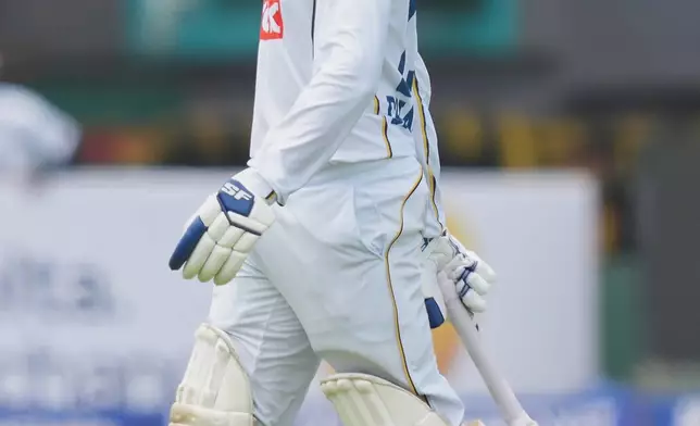 Sri Lanka's captain Dhananjaya de Silva walks off the filed after losing his wicket during the day three of the first cricket test match between Sri Lanka and India In Galle, Sri Lanka, Monday, Aug. 17, 2026. (AP Photo/Eranga Jayawardena)