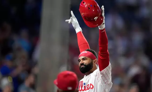 Philadelphia Phillies' Derek Hill reacts after hitting a grand slam against Washington Nationals pitcher Tom Cosgrove during the seventh inning of a baseball game Monday, Aug. 3, 2026, in Philadelphia. (AP Photo/Matt Slocum)