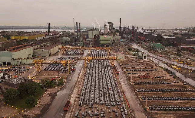 Rolled coils of steel sit in the yard at the ArcelorMittal Dofasco steel plant in Hamilton, Ont. on Thursday, Aug. 20, 2026. (Nick Iwanyshyn /The Canadian Press via AP)