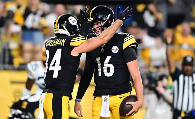 Pittsburgh Steelers running back Max Hurleman (84) and quarterback Drew Allar (16) celebrate Allar's touchdown run in the second half of a preseason NFL football game against the Green Bay Packers in Pittsburgh, Thursday, Aug. 13, 2026. (AP Photo/David Dermer)