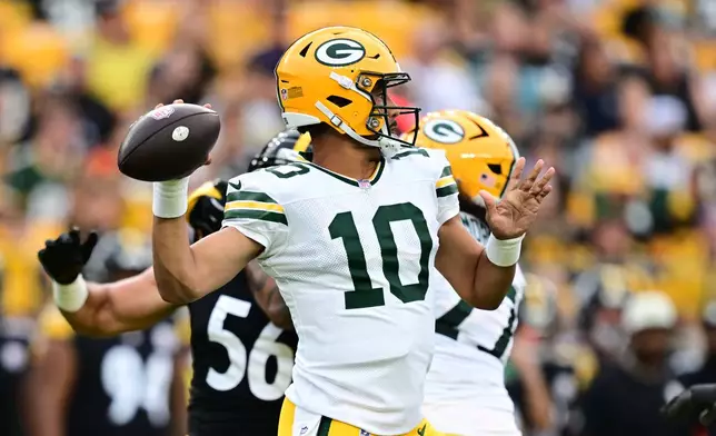 Green Bay Packers quarterback Jordan Love throws a pass in the first half of a preseason NFL football game against the Pittsburgh Steelers in Pittsburgh, Thursday, Aug. 13, 2026. (AP Photo/David Dermer)