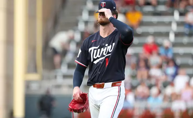 Minnesota Twins starting pitcher Bailey Ober reacts after giving up a two run home run to Baltimore Orioles' Gunnar Henderson during the first inning of a baseball game, Tuesday, Aug. 11, 2026, in Minneapolis. (AP Photo/Matt Krohn)