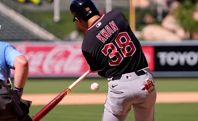 Cleveland Guardians' Steven Kwan hits an RBI ground run double during the ninth inning of a baseball game against the Los Angeles Angels, Wednesday, Aug. 26, 2026, in Anaheim, Calif. (AP Photo/Mark J. Terrill)