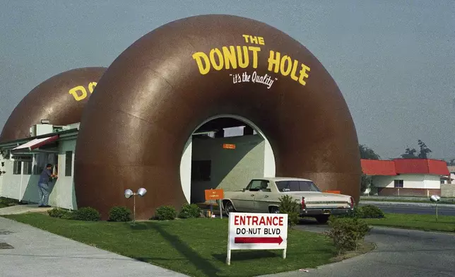 FILE - A drive-thru coffee and donut shop the Donut Hole is seen in Los Angeles in November 1970. (AP Photo/David F. Smith, File)
