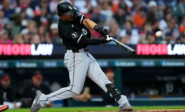 Chicago White Sox's Miguel Vargas hits a two-run home run against the Detroit Tigers during the sixth inning of a baseball game Friday, Aug. 14, 2026, in Detroit. (AP Photo/Paul Sancya)