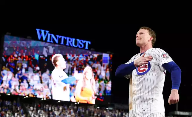 Chicago Cubs' Pete Crow-Armstrong gestures toward the crowd after hitting a walkoff home run during the 10th inning of a baseball game to defeat the Chicago White Sox in Chicago, Monday, Aug. 17, 2026. (AP Photo/Jessie Alcheh)