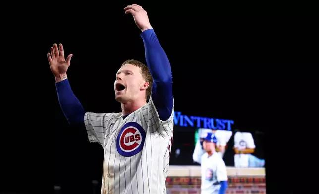 Chicago Cubs' Pete Crow-Armstrong gestures toward the crowd after hitting a walkoff home run during the 10th inning of a baseball game to defeat the Chicago White Sox in Chicago, Monday, Aug. 17, 2026. (AP Photo/Jessie Alcheh)