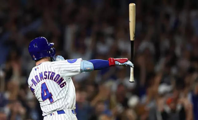 Chicago Cubs' Pete Crow-Armstrong tosses his bat after hitting a walkoff home run during the 10th inning of a baseball game to defeat the Chicago White Sox in Chicago, Monday, Aug. 17, 2026. (AP Photo/Jessie Alcheh)