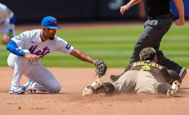 San Diego Padres' Xander Bogaerts (2) dives into second base after hitting a double during the fifth inning of a baseball game against the New York Mets, Wednesday, Aug. 19, 2026, in New York. (AP Photo/Yuki Iwamura)