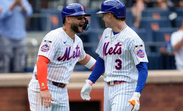New York Mets' Carson Benge (3) celebrates with Bo Bichette after hitting a two-run home run during the fourth inning of a baseball game against the San Diego Padres, Wednesday, Aug. 19, 2026, in New York. (AP Photo/Yuki Iwamura)
