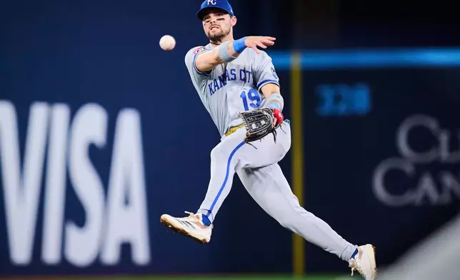 Kansas City Royals second baseman Michael Massey (19) throws to first during the fifth inning of a baseball game against the Toronto Blue Jays in Toronto, Tuesday, Aug. 25, 2026. (Sammy Kogan/The Canadian Press via AP)