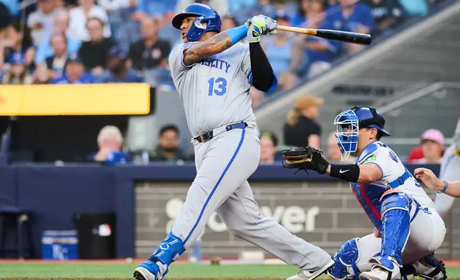 Kansas City Royals' Salvador Perez (13) grounds into a double play as Carter Jensen, not shown, scores against the Toronto Blue Jays during the second inning of a baseball game in Toronto, Tuesday, Aug. 25, 2026. (Sammy Kogan/The Canadian Press via AP)