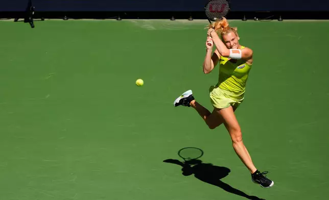 Katerina Siniakova, of the Czech Republic, returns the ball during a mixed doubles match at the U.S. Open tennis championships, Tuesday, Aug. 25, 2026, in New York. (AP Photo/Yuki Iwamura)