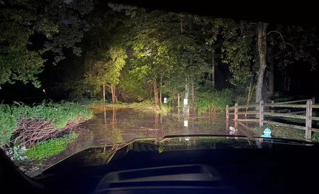 This photo provided by the Indianapolis Fire Department shows flooding in northern Indianapolis, Ind., Saturday, Aug. 15, 2026. (Indianapolis Fire Department via AP)