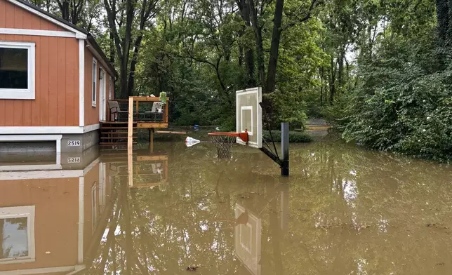 This photo provided by the Indianapolis Fire Department shows flooding in northern Indianapolis, Ind., Saturday, Aug. 15, 2026. (Indianapolis Fire Department via AP)