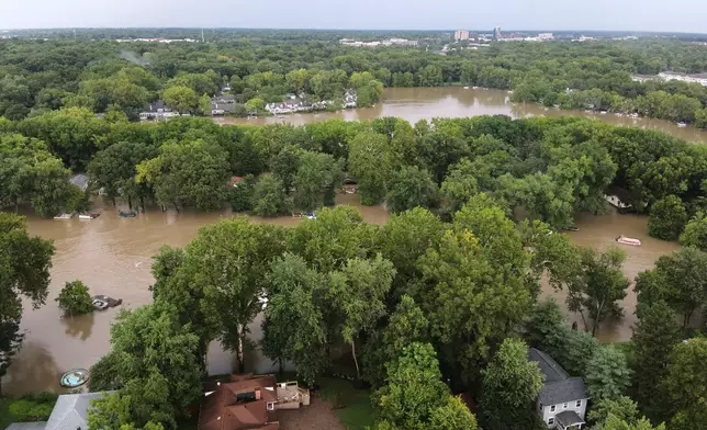 This aerial photo provided by the Indianapolis Fire Department shows flooding in northern Indianapolis, Ind., Saturday, Aug. 15, 2026. (Indianapolis Fire Department via AP)