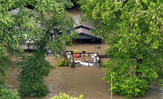 This aerial photo provided by the Indianapolis Fire Department shows flooding in northern Indianapolis, Ind., Saturday, Aug. 15, 2026. (Indianapolis Fire Department via AP)