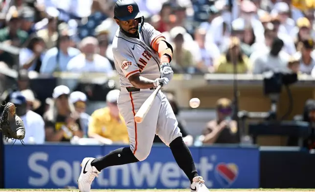 San Francisco Giants' Osleivis Basabe hits a solo home run during the fifth inning of a baseball game against the San Diego Padres, Sunday, Aug. 2, 2026, in San Diego. (AP Photo/Denis Poroy)