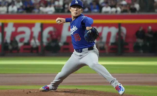 Los Angeles Dodgers pitcher Yoshinobu Yamamoto throws against the Arizona Diamondbacks in the first inning of a baseball game, Saturday, Aug. 8, 2026, in Phoenix. (AP Photo/Rick Scuteri)