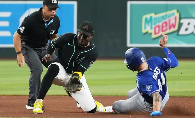 Los Angeles Dodgers' Andy Pages (44) steals second base under the tag by Arizona Diamondbacks shortstop Geraldo Perdomo in the seventh inning of a baseball game, Saturday, Aug 8, 2026, in Phoenix. (AP Photo/Rick Scuteri)