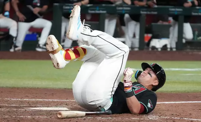 Arizona Diamondbacks' Lars Nootbaar reacts after a foul ball in the sixth inning of a baseball game against the Los Angeles Dodgers, Saturday, Aug 8, 2026, in Phoenix. (AP Photo/Rick Scuteri)