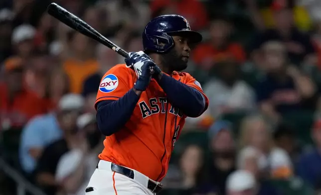 Houston Astros' Yordan Alvarez watches his RBI double during the fifth inning of a baseball game against the Athletics, Friday, Aug. 21, 2026, in Houston. (AP Photo/Kevin M. Cox)