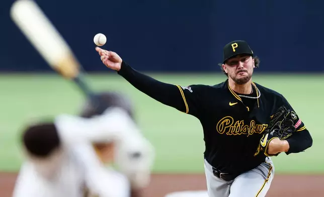 Pittsburgh Pirates' Paul Skenes, right, delivers a pitch to San Diego Padres' Manny Machado in the first inning of a baseball game Tuesday, Aug. 25, 2026, in San Diego. (AP Photo/Derrick Tuskan)