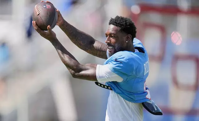 Tennessee Titans wide receiver Calvin Ridley makes a catch during the NFL football team's training camp Tuesday, Aug. 4, 2026, in Nashville, Tenn. (AP Photo/George Walker IV)