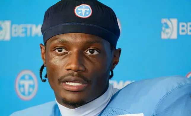 Tennessee Titans wide receiver Carnell Tate (14) speaks at a news conference during the NFL football team's training camp Monday, Aug. 3, 2026, in Nashville, Tenn. (AP Photo/George Walker IV)