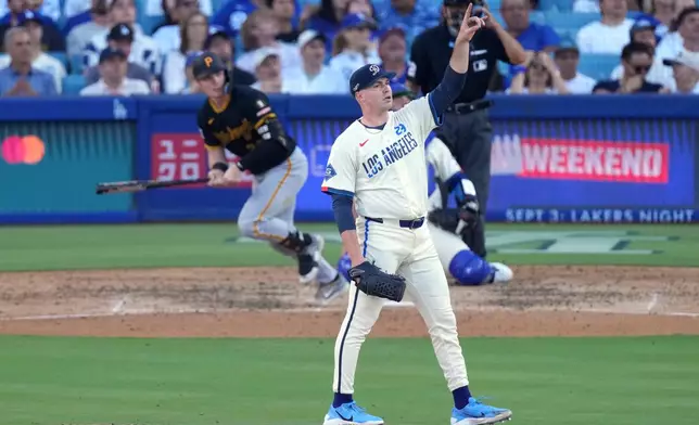 Los Angeles Dodgers starting pitcher Tarik Skubal, right, gestures as Pittsburgh Pirates' Henry Davis flies out during the seventh inning of a baseball game Saturday, Aug. 22, 2026, in Los Angeles. (AP Photo/Mark J. Terrill)