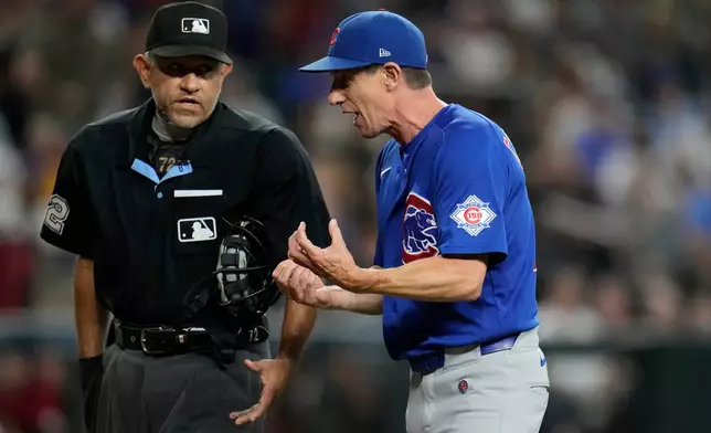Chicago Cubs manager Craig Counsell, right, argues with home plate umpire Alfonso Márquez during the sixth inning of a baseball game against the Arizona Diamondbacks, Wednesday, Aug. 26, 2026, in Phoenix. (AP Photo/Ross D. Franklin)