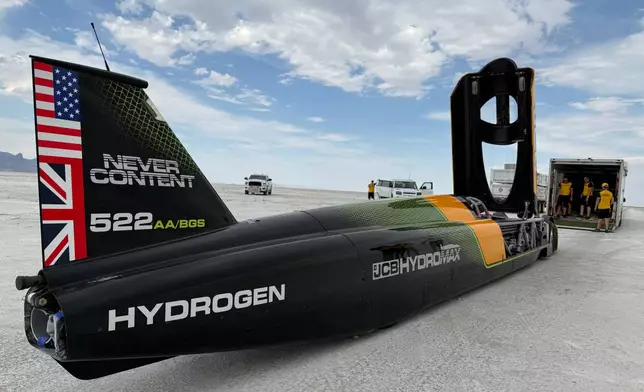 The JCB Hydromax sits on the Bonneville Salt Flats in Wendover, Utah, where Andy Green aims to drive it to a land speed record for cars powered by hydrogen internal combustion engines, Monday, Aug. 10, 2026. (AP Photo/Hannah Schoenbaum)