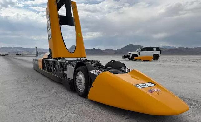 The JCB Hydromax sits on the Bonneville Salt Flats in Wendover, Utah, where Andy Green aims to drive it to a land speed record for cars powered by hydrogen internal combustion engines, Monday, Aug. 10, 2026. (AP Photo/Hannah Schoenbaum)