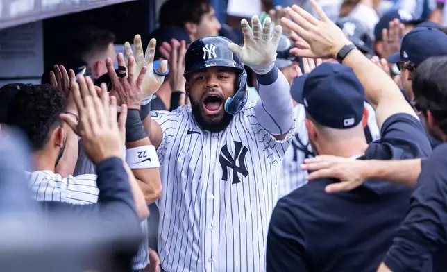 New York Yankees' Heliot Ramos celebrates in the dugout after hitting a three-run home run in the fifth inning during a baseball game against the Boston Red Sox, Sunday, Aug. 30, 2026, in New York. (AP Photo/Corey Sipkin)