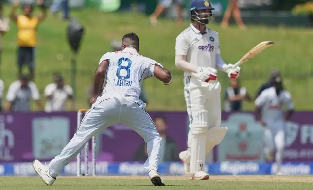 Sri Lanka's Lahiru Kumara, left, celebrates taking the wicket of India's KL Rahul during day one of the second cricket test match between Sri Lanka and India in Colombo, Sri Lanka, Sunday, Aug. 23, 2026. (AP Photo/Eranga Jayawardena)