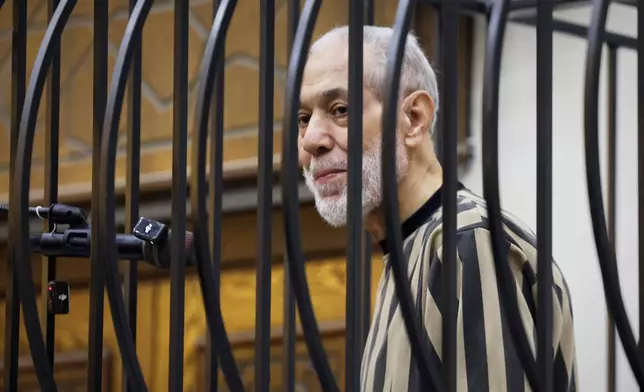 Syria's former grand mufti under ousted President Bashar Assad, Ahmad Badreddine Hassoun, stands as a court sentences him to life in prison at the Palace of Justice in Damascus, Syria, Monday, Aug. 24, 2026. (AP Photo/Ghaith Alsayed)