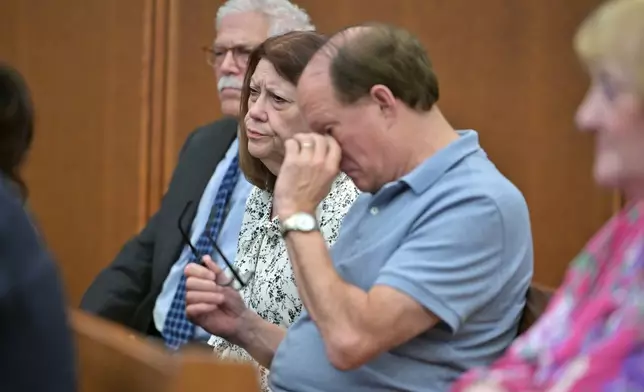 Paula Musgrove, center and Mike Musgrove, right, parents of Lindsay Clancy react to testimony during Clancy's murder trial, Thursday, Aug. 13, 2026., in Plymouth, Mass. (AP Photo/Josh Reynolds, Pool)
