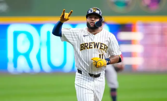 Milwaukee Brewers' Jackson Chourio reacts after hitting a home run during the first inning of a baseball game against the Minnesota Twins, Sunday, Aug. 9, 2026, in Milwaukee. (AP Photo/Kayla Wolf)