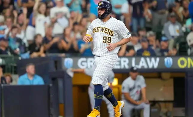 Milwaukee Brewers' Gary Sánchez scores on an RBI double hit by David Hamilton during the fifth inning of a baseball game against the Minnesota Twins Sunday, Aug. 9, 2026, in Milwaukee. (AP Photo/Kayla Wolf)