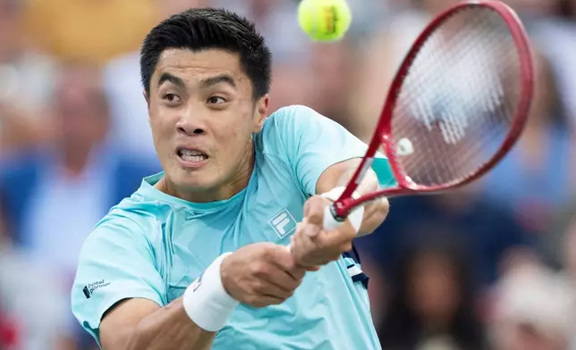Brandon Nakashima of the United States hits a return to Rafael Jodar of Spain during a semifinal tennis match at the National Bank Open in Montreal, Wednesday, Aug. 12, 2026. (Christinne Muschi/The Canadian Press via AP)