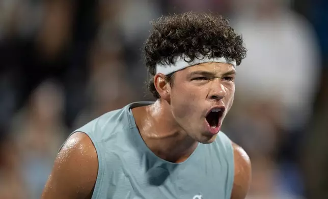 Ben Shelton of the United States celebrates his win over compatriot Learner Tien during a semifinal tennis match at the National Bank Open in Montreal on Wednesday, Aug. 12, 2026. (Christinne Muschi/The Canadian Press via AP)