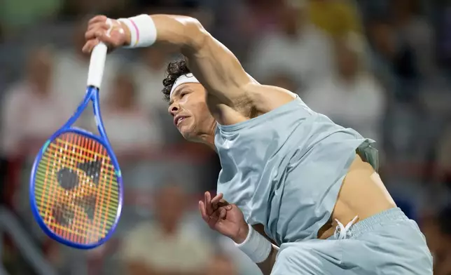 Ben Shelton of the United States serves to his compatriot Learner Tien during a semifinal tennis match at the National Bank Open in Montreal on Wednesday, Aug. 12, 2026. (Christinne Muschi/The Canadian Press via AP)