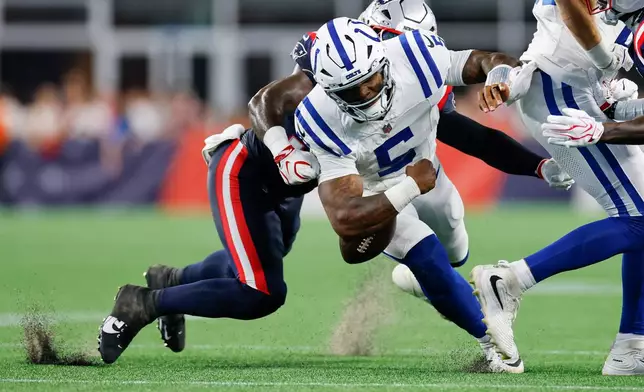 New England Patriots Isaiah Iton forces Indianapolis Colts quarterback Anthony Richardson Sr. (5) to fumble the ball during the first half of an NFL preseason football game, Thursday, Aug. 13, 2026, in Foxborough, Mass. (AP Photo/CJ Gunther)