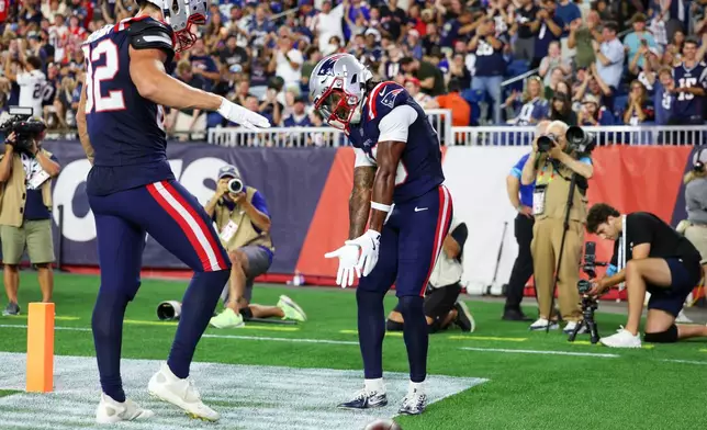 New England Patriots wide receiver Kyle Williams celebrates his touchdown against the Indianapolis Colts during the first half of an NFL preseason football game, Thursday, Aug. 13, 2026, in Foxborough, Mass. (AP Photo/Mark Stockwell)