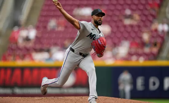 Miami Marlins pitcher Sandy Alcantara throws during the first inning of a baseball game against the Cincinnati Reds in Cincinnati, Friday, Aug. 14, 2026. (AP Photo/Carolyn Kaster)