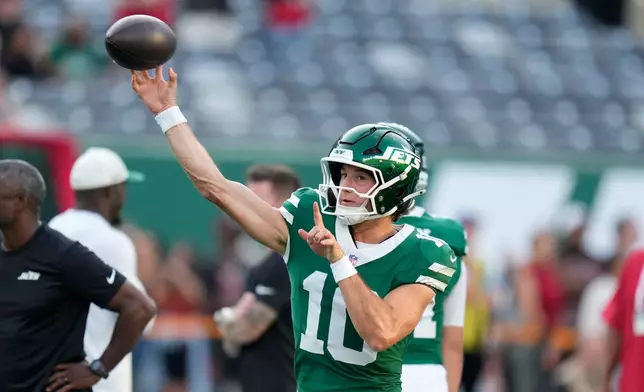 New York Jets quarterback Cade Klubnik warms up before a preseason NFL football game against the Tampa Bay Buccaneers, Friday, Aug. 14, 2026, in East Rutherford, N.J. (AP Photo/Seth Wenig)