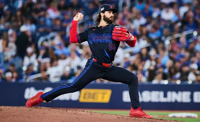 Toronto Blue Jays' Dylan Cease works against the Seattle Mariners during the third inning of a baseball game in Toronto, Friday, Aug. 28, 2026. (Sammy Kogan/The Canadian Press via AP)